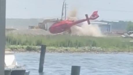 Watch: Moment helicopter flips and crash lands outside Michigan restaurant