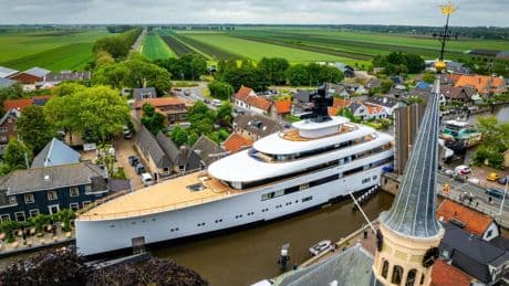 Plush £150m superyacht laden with luxuries like jacuzzi & helipad owned by ex-Starbucks CEO squeezes through Dutch canal