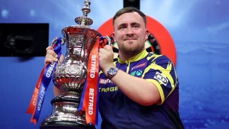 Luke Littler is darts Triple Crown king as the Nuke savours seeing his name being added to idol's trophy