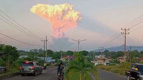 Dozens of Bali flights cancelled after volcano erupts in Indonesia
