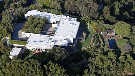 Car smashes into Jennifer Aniston's Bel Air mansion with intruder apprehended in star's second crash incident to home