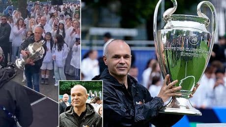 Barcelona legend Andres Iniesta sends fans into a frenzy as he delivers the Champions League trophy to Munich ahead of the final between PSG and Inter Milan