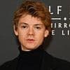 Love Actually star Thomas Brodie-Sangster and late Bond star Sean Connery pictures go viral as it's revealed they were both aged 34 when taken