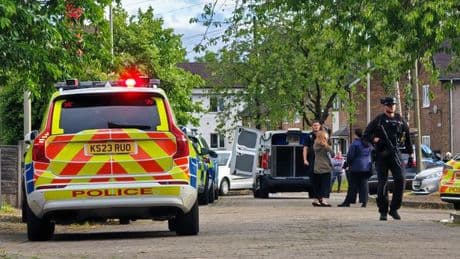 Baby among three rushed to hospital after dog attack as armed cops swarm