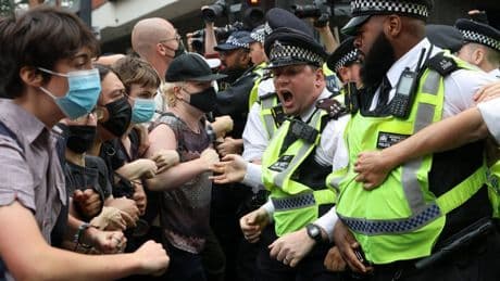 Rival groups clash at protest outside London asylum hotel