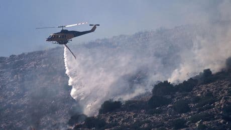 Wildfire prompts evacuations near Athens as summer's 1st heat wave hits Greece