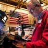 Asian shares are mostly lower after a mixed session on Wall Street