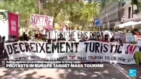 Spaniards turn water guns on visitors in Barcelona and Mallorca to protest mass tourism