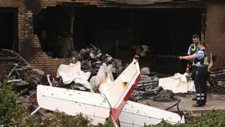 Two killed after small plane crashes into terraced house and bursts into flames in Germany