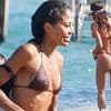 Emma Weymouth shows off her svelte physique in a brown thong bikini as she soaks up the sun at a swanky beach club with husband Ceawlin Thynn in St Tropez
