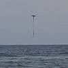 Incredible footage captures moment drowning young girl caught in rip current is saved by fisherman's drone