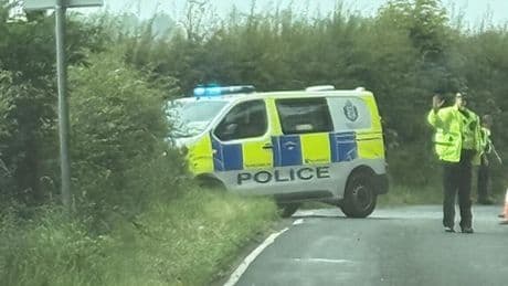 Police officers injured after marked van crashes on country road