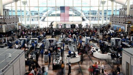 Passengers flee smoking jet on emergency slide after apparent landing gear problem at Denver airport