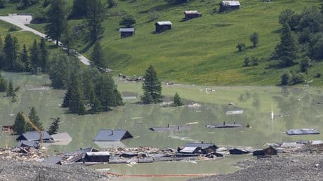 A river dammed by a huge Swiss landslide is flowing again. That's a relief to authorities