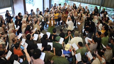 Photos show games, dancing and singing bringing people together in Indonesia