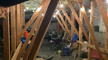 Man arrested for allegedly living in crawl space of housing complex