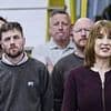 Chancelbore of the Exchequer: Weary factory workers steal the show in the background at Rachel Reeves' trains and spending speech