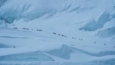 AP PHOTOS: Hundreds scale Mount Everest in a weather-hit climbing season