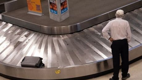 Tiny suitcase label which 'guarantees' your luggage is first off the plane