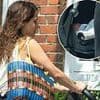 Baby joy! Tiger Lily Hutchence confirms the birth of her first child as she pushes her newborn in a stroller in London after 'secretly marrying partner Ben Archer'