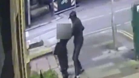 Harrowing moment balaclava-clad thug randomly snatches woman off street