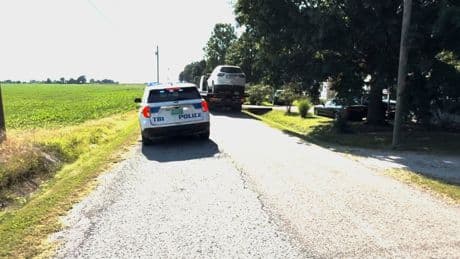 2 men charged after being linked to a suspect in the killings of 4 relatives of an abandoned infant