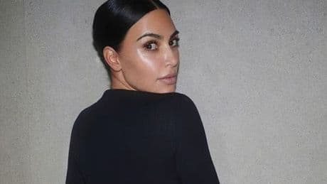 Kim Kardashian almost bares all as she shares snaps of her bum in sheer underwear
