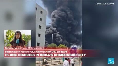Smoke and fire rises from India plane crash site