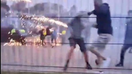 Moment Bohemians and Derry football thugs attack each other with fireworks