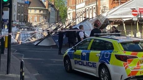 Scaffolding collapses onto east London high street ‘trapping car beneath rubble’