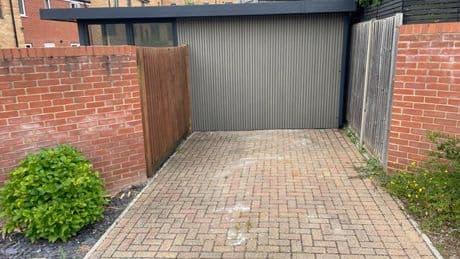 Couple ordered to tear down home gym in neighbour war over parking spaces