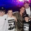 The Rooneys get kitted out in Oasis merchandise as they enjoy band's reunion gig with their children