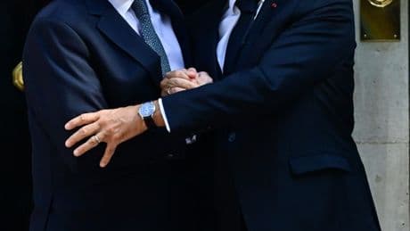 Macron & Starmer embrace before crunch summit as ANOTHER packed boat of 70 migrants is escorted to British waters