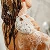 You're showering wrong! Experts reveal the correct order to wash your body - and warn 80% of us get it muddled