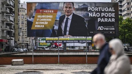 Portuguese PM's party claims election win, falls short of majority