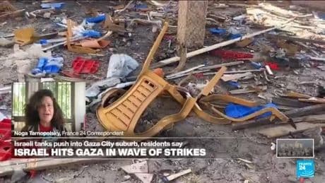 74 killed in Gaza as Israeli forces strike a cafe and fire on people seeking food