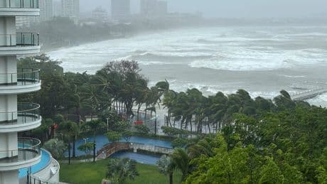 A severe tropical storm heads for southern China after toppling trees on Hainan island