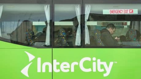 Woman arrested as 2-year-old girl found alive in suitcase stowed in bus luggage