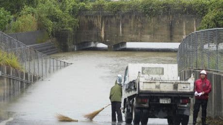 Heavy rains in southern Japan cause flooding and mudslides, and leave several people missing