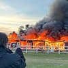 Arrest made after fire destroyed historic World War One hangar days after developers were granted permission to build new homes... on the condition they restore it