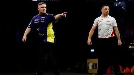 Luke Littler narrowly avoids being hit by object thrown at him while on O2 stage during Premier League Darts finals