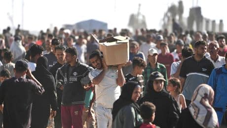 Dozens injured after gunfire at aid hub in Gaza