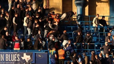 Chelsea CHAOS as visiting Djurgarden fans jump barrier forcing riot police to intervene