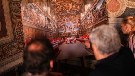 Vatican workers install Sistine Chapel stove where ballots are burned during conclave to elect pope