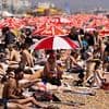 UK will be even hotter tomorrow: Temperatures could hit 35C as amber health alert is extended across England after sunseekers flocked to the coast as 'killer' heatwave gripped Britain