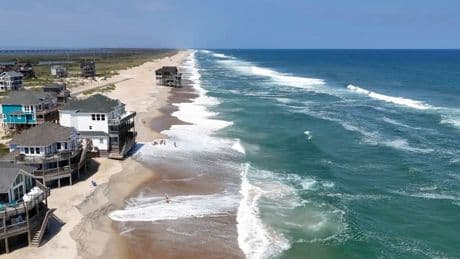 Summer celebrations meet closed beaches and warnings on US East Coast due to Hurricane Erin