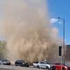 Petrifying moment 'dust devil' tornado tears through UK city leaving stunned Brits in its wake