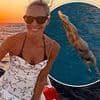 Jenni Falconer, 48, sizzles in black bikini as she plunges off a lavish yacht during a fun-filled family holiday