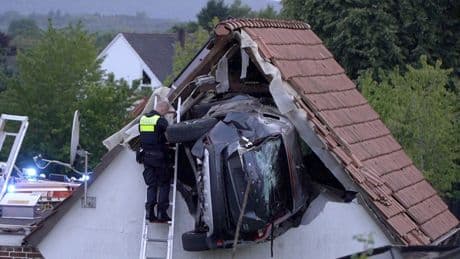 Car crashes into a barn's roof in Germany, seriously injuring 2