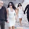 Charli XCX wears a bridal white lace mini dress with her husband George Daniel as the couple sip on cocktails ahead of second wedding in Italy